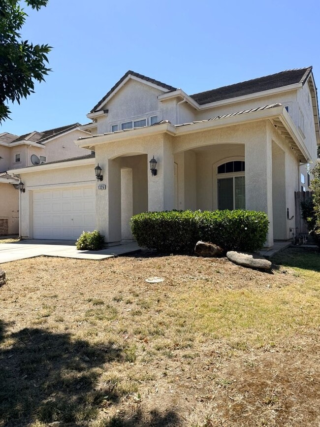 Photo - A must see 4/3 with a bedroom downstairs for convenience.