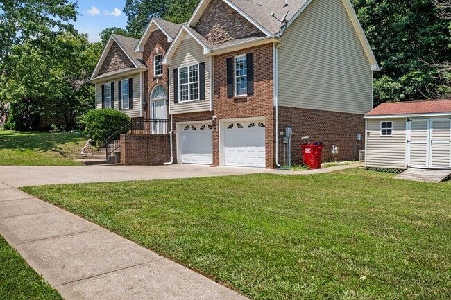 Photo - Stunning Stone Fireplace • Finished Basement • Fenced Yard