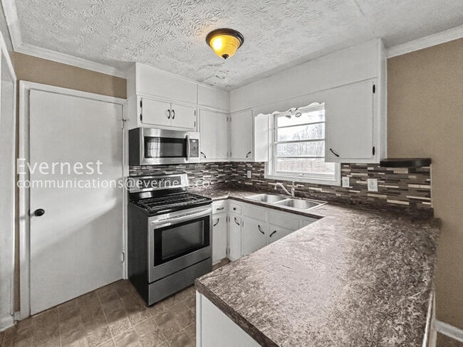 Photo - 3 Bed, 2 Bath Home with Carport / Pet-Friendly / Coming Soon!