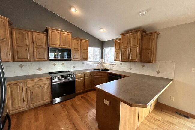 Photo - Spacious 5-Bedroom Home with Finished Basement and 3-Car Garage in Wellington