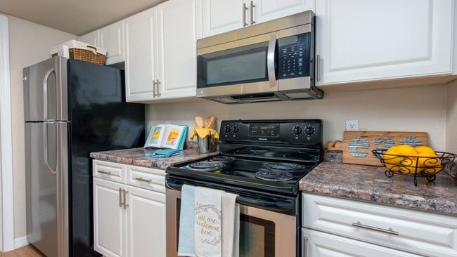 Our contemporary kitchens feature stainless-steel appliances and abundant upper and lower cabinetry.
