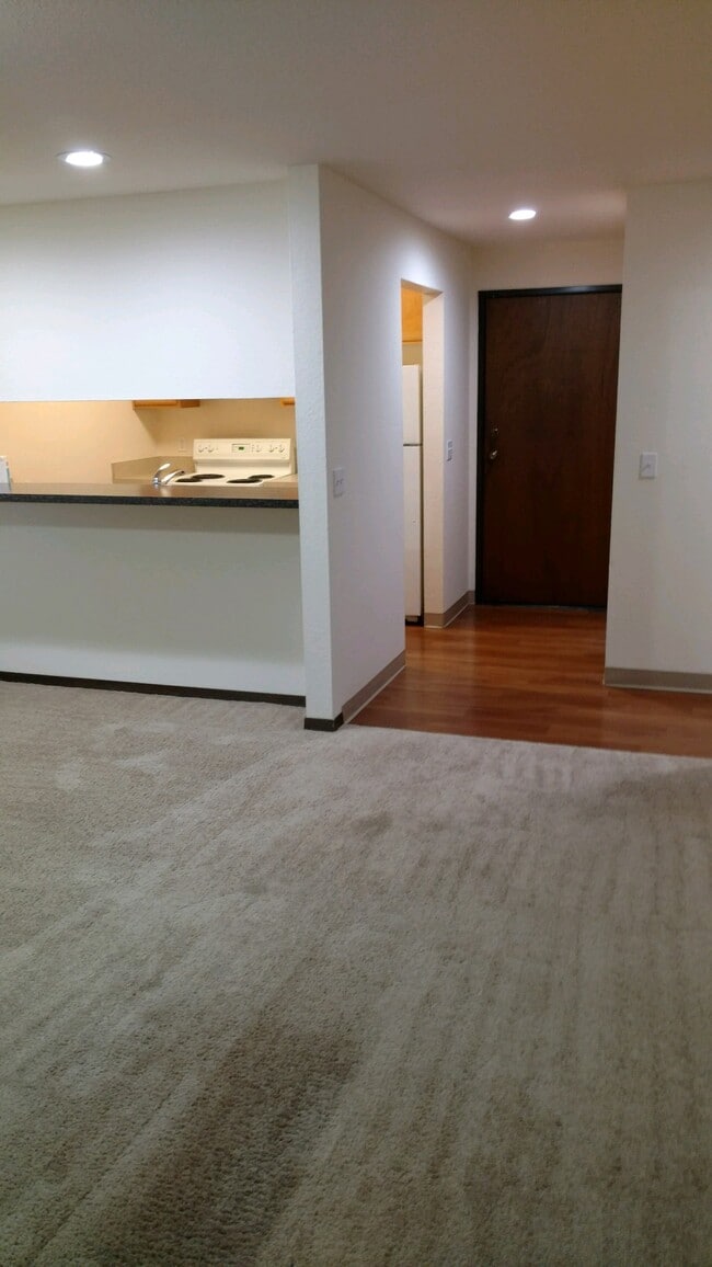 #103 Kitchen from living room - Pinehurst Apartments