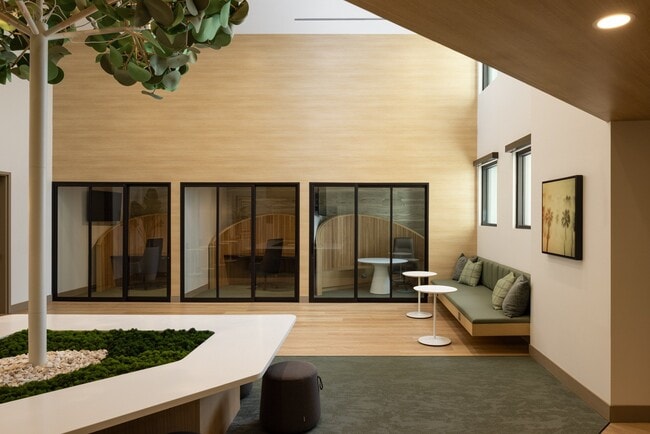 Cowork space with private pods, individual seating, and collaborative areas