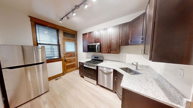 Photo - Stunning updated Wrigleyville 4-bed, 3-bath duplex featuring a modern kitchen, renovated baths & ... Unit 1251-1