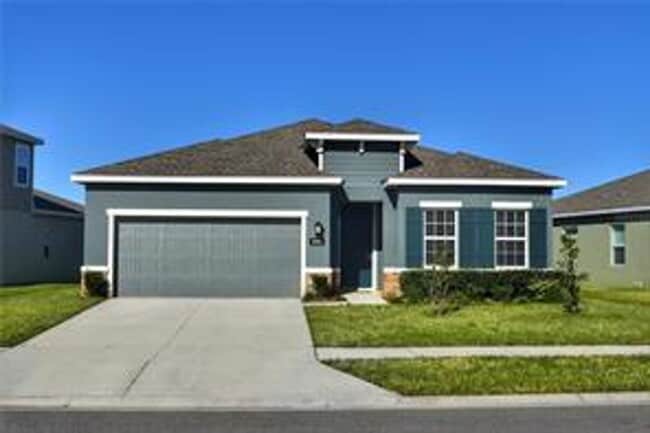 Building Photo - Open concept home offering four bedrooms, three baths, a two car garage and open lanai.