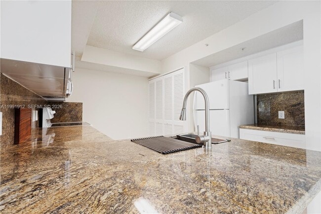 Building Photo - 9615 NW 1st Ct Unit 10-204