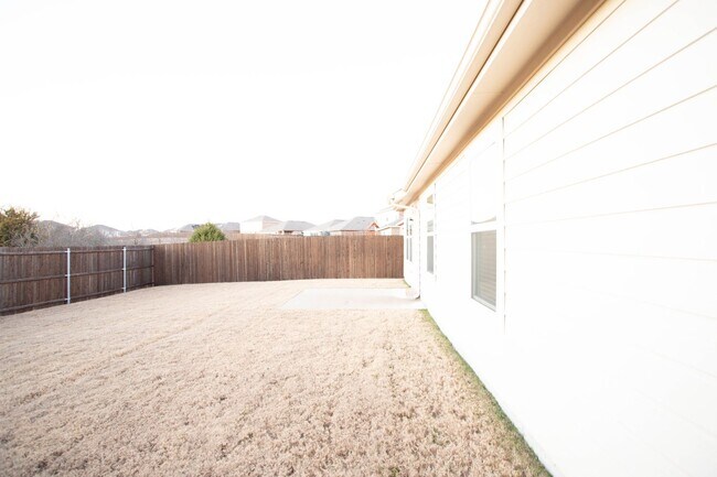 Photo - Located in the Trails at Riverstone community, this inviting 5-bedroom, 2-bathroom home offers a ...