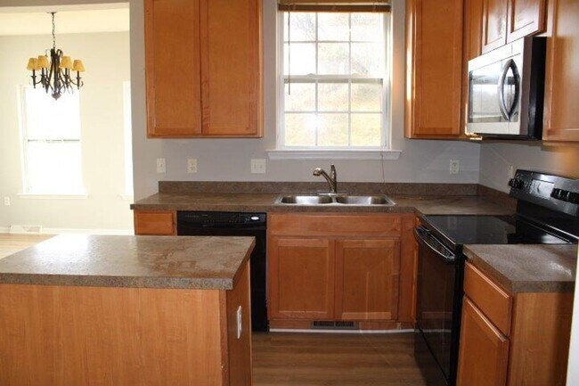 Photo - Modern 3-Story Townhouse Living with Garage