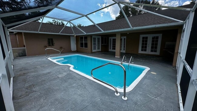 Photo - SPACIOUS 4-BEDROOM HOME WITH SCREENED POOL IN SE CAPE CORAL