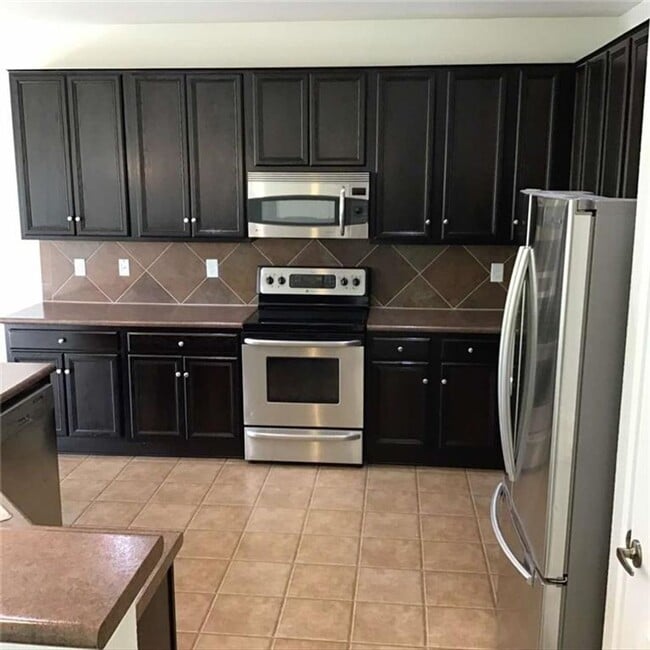 Photo - Extensive solar panels resulting in minimal to no electric cost. Dont Miss out!