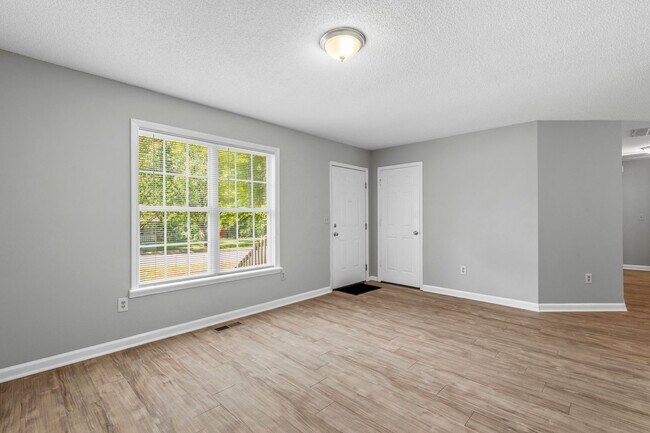 Photo - NW Home - Updated Kitchen and Bathrooms, Wood Laminate Flooring, Deck, Must See!