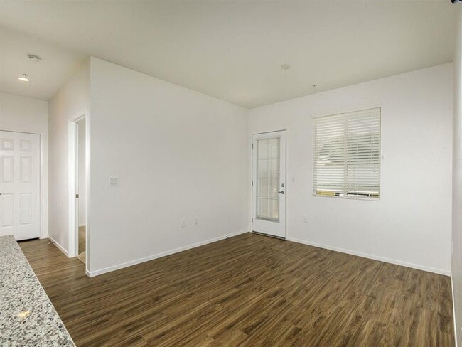 Patio door with a window on the side and spacious living room