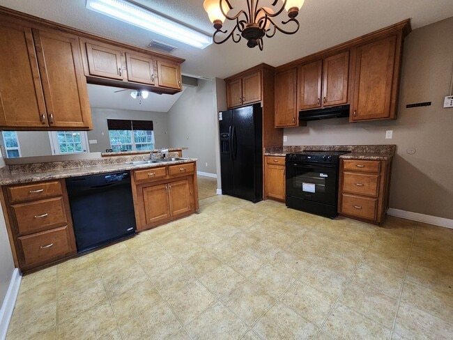 Photo - Charming 3BR/2BA Home with Open Floor Plan, Vaulted Ceilings & 2-Car Garage