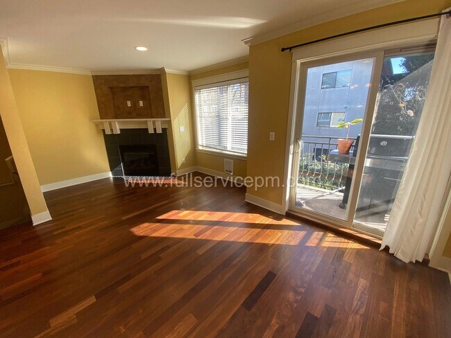 Photo - Spacious townhome with private backyard, garage parking, multiple decks, and a dedicated home off...