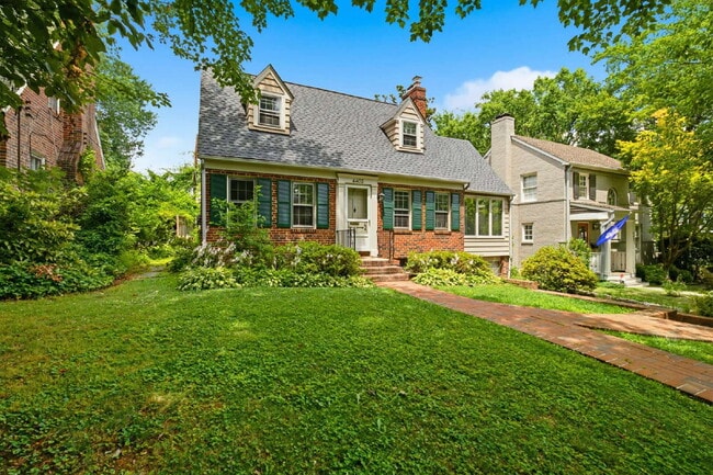 Photo - Elegant Center-Hall Cape Cod with Sunroom, Garage & Timeless Charm