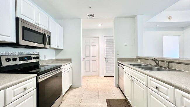 Building Photo - 1200 Town Center Dr Unit 201