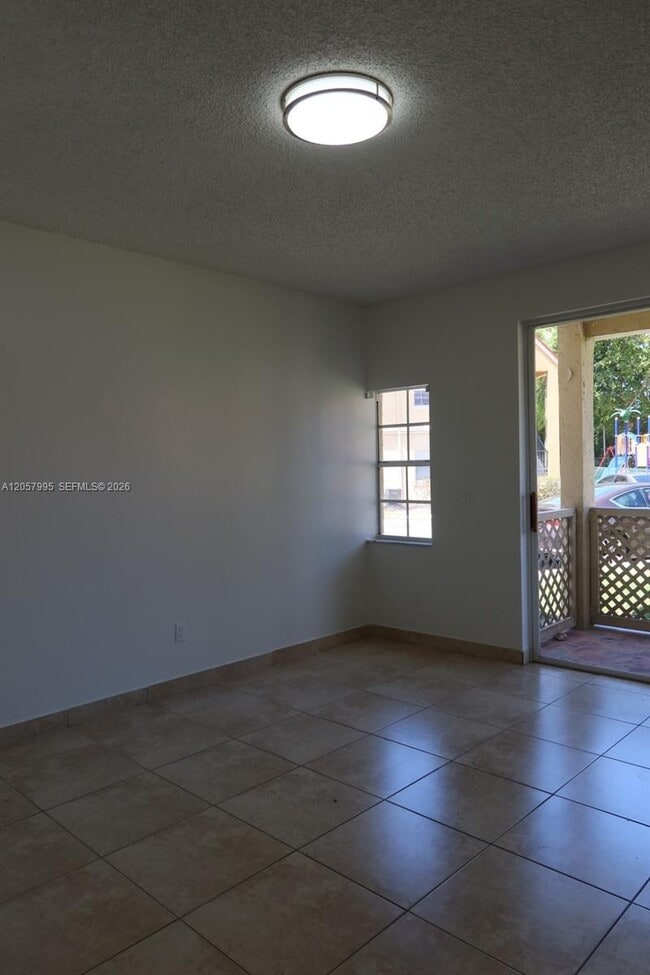 Building Photo - 18340 NW 68th Ave Unit A