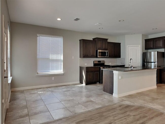 Photo - 5BR/4BA | Updated Single Family Home | 2-Car Garage | Gated backyard
