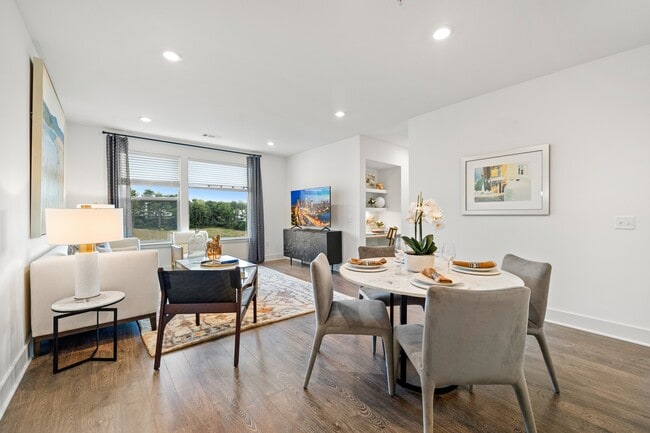 Open-concept living and modern wide-plank wood-style flooring