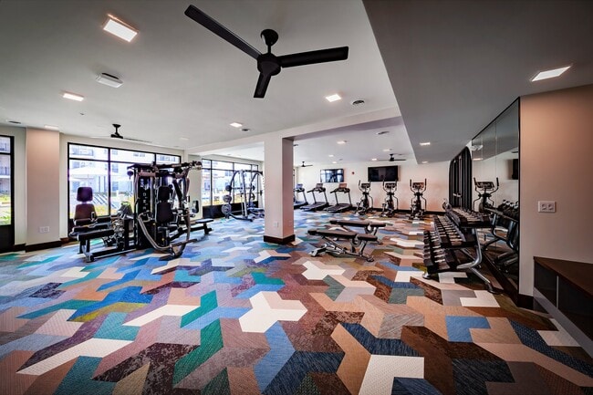 24-hour fitness center with cardio equipment, strength-training machines, and free weights for convenient on-site workouts.