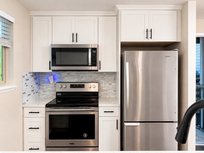 Photo - Modern Wooded Condo with Upgraded Kitchen & Private Deck