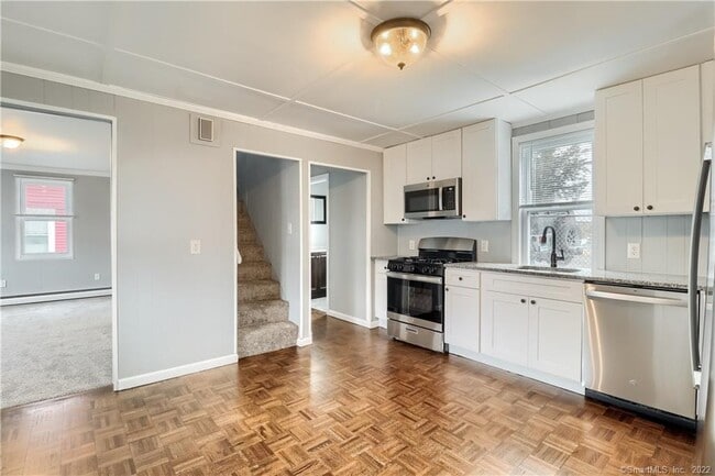 Kitchen with stairs to Bedrooms