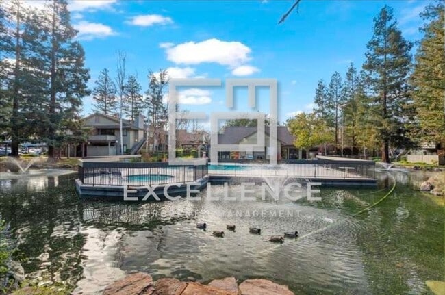 Photo - 1/1 Condo with Vaulted Ceilings, Community Pool, Parking, Fireplace and Updated Throughout!