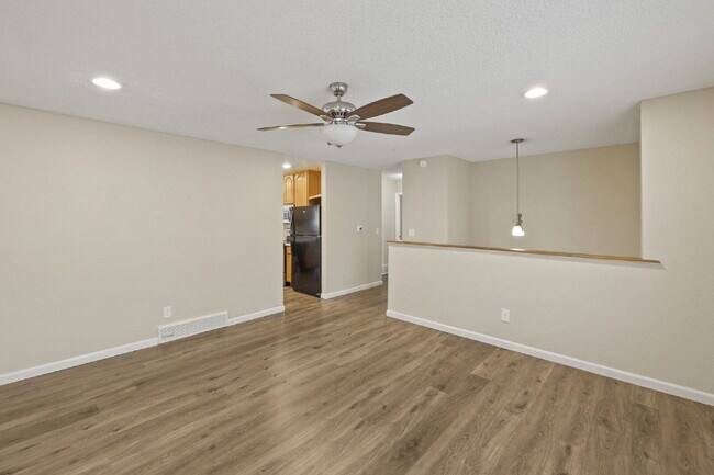 Photo - Spacious Split-Level Home with Finished Basement, Deck, Fenced Yard & 2-Car Garage