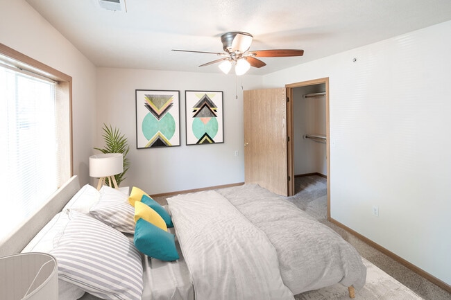 Huge Bedroom with Large Windows, Ceiling Fan, and Walk-in Closet