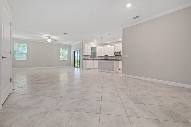 Photo - "Spacious 4-Bed Oasis with Granite Charm in Lutz!"In a gated community with 2 Cars garage