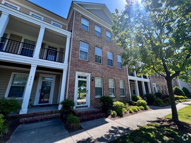 Building Photo - Elegant three story brick townhome with a ...