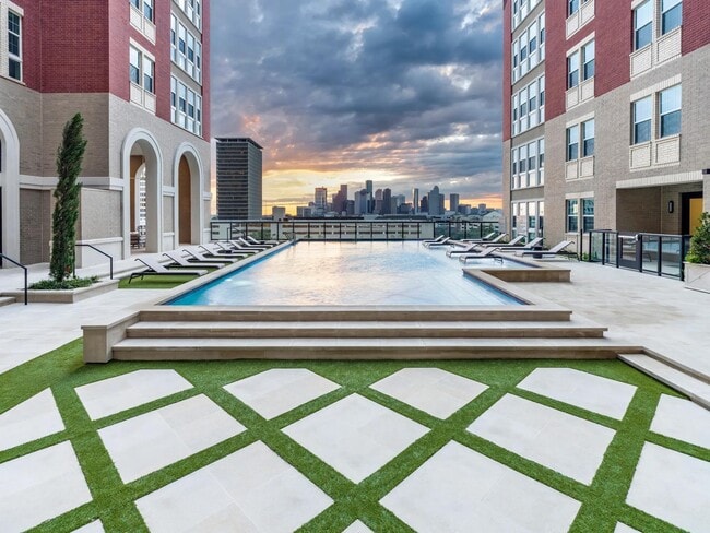 Take in the amazing view of the Houston skyline at the Arbor resort-style pool with cabanas.