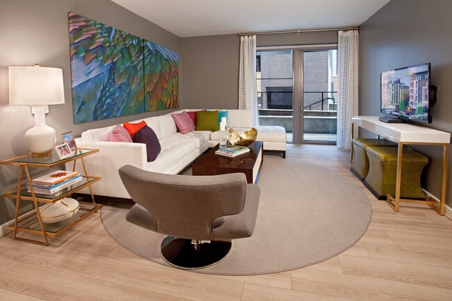 Living area with hard surface flooring and balcony