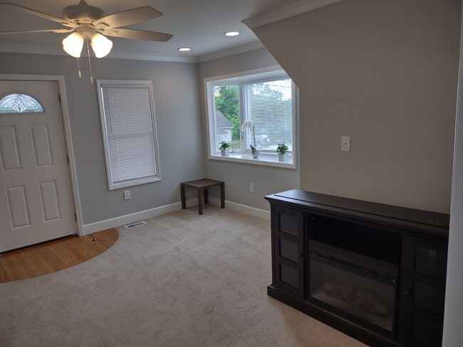 living room, notice the beautiful bay window - 1208 E Main St