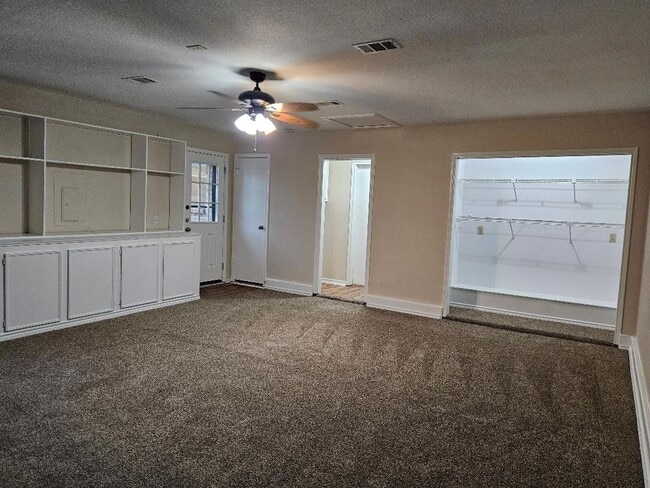 Photo - Three bedroom and two bathroom nicely remodeled with new flooring. Large wood fenced backyard