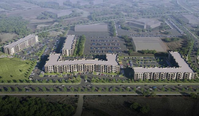 Aerial rendering of Sageland Flats at Brooks with multiple residential buildings, parking areas, landscaped roads, and green surroundings - Sageland Flats at Brooks