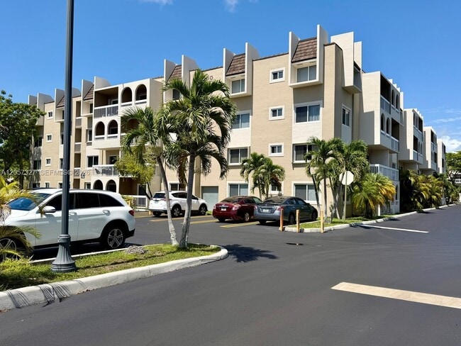 Building Photo - 7730 Camino Real Unit F 406