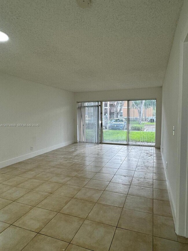 Building Photo - 8801 Wiles Rd Unit 103