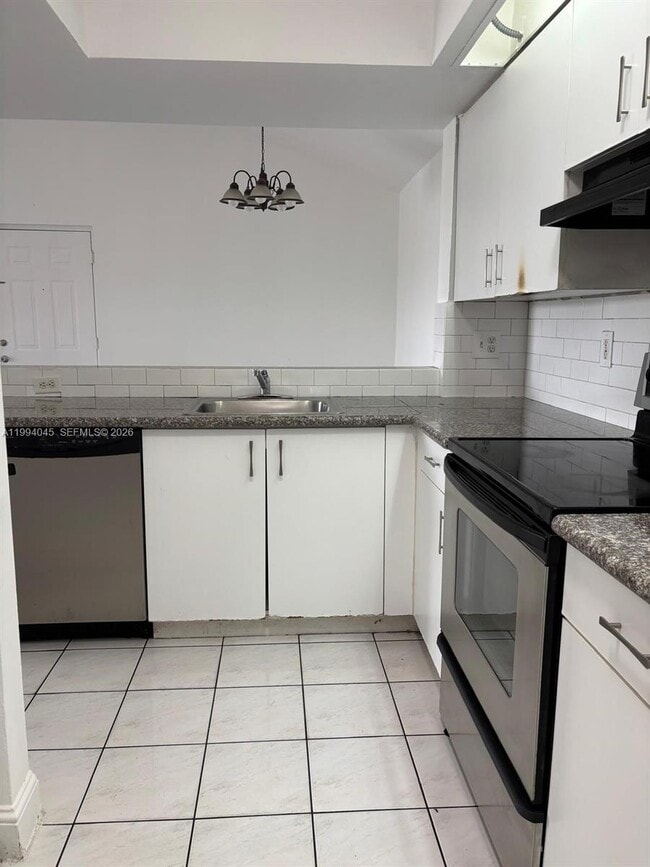 Building Photo - 18810 NW 57th Ave Unit 303