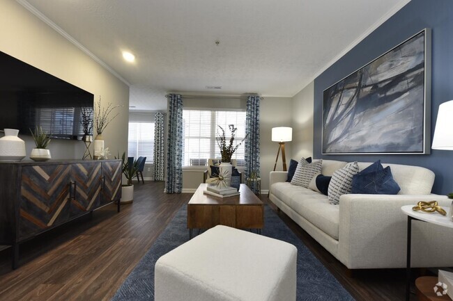 Living Room with Hardwood Style Flooring - The Adler Apartment Homes