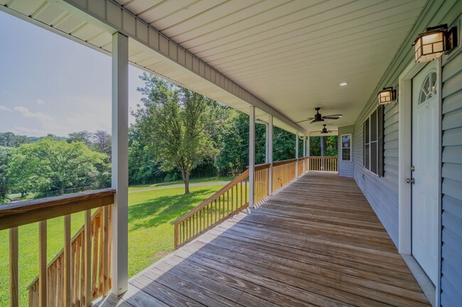 Photo - SHORT TERM - Spacious 3-Bedroom home with Wrap-Around Porch