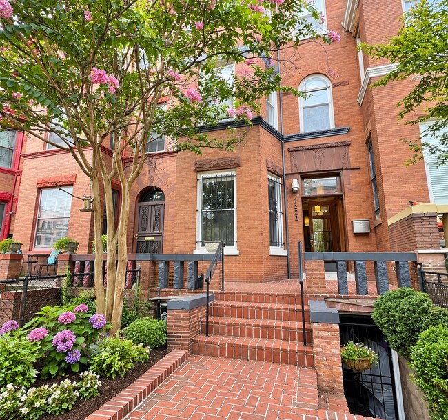 Classic brick exterior with welcoming front entrance and landscaped yard - 2322 1st St NW