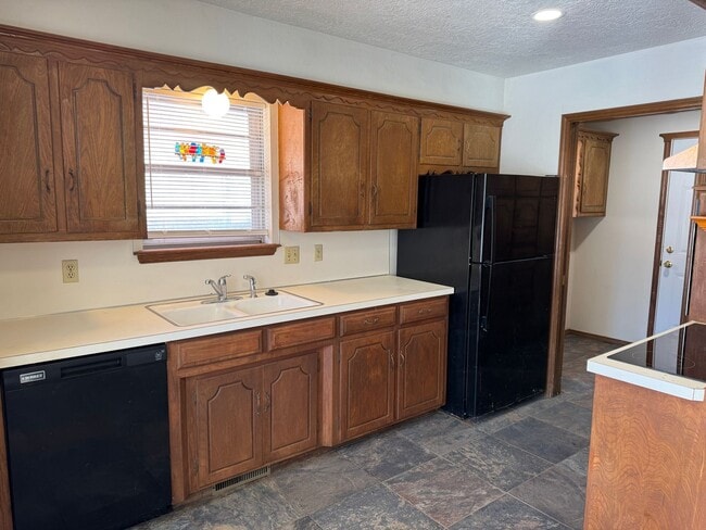 Photo - 3 bed, 2 bath, 2 car with 2 extra living spaces and new appliances, paint and carpet! Located clo...