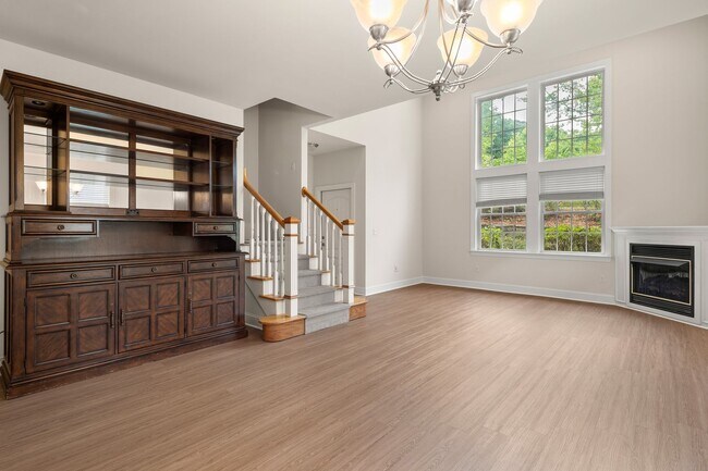Photo - Five-Bedroom Tudor Home with Main-Level Primary Suite in Albemarle Reserve