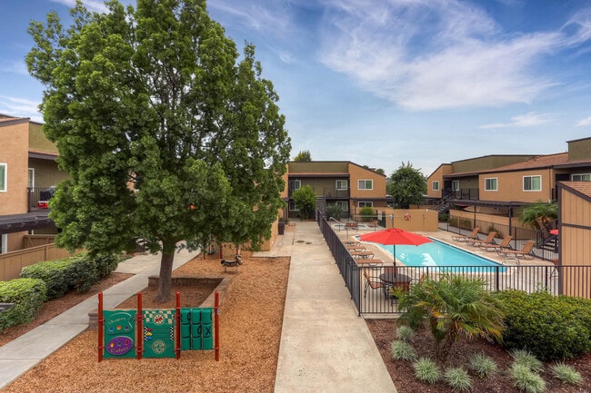 The Community Courtyard, Pool, and Playground at Midway Gardens Apartments - Midway Gardens Apartments