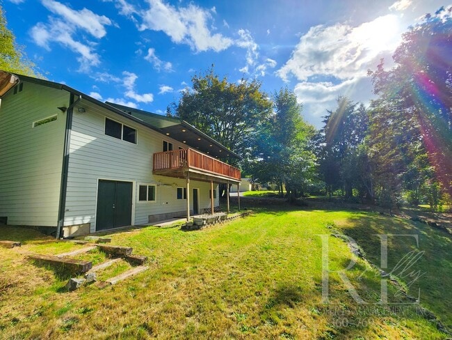 Building Photo - Vaulted Ceilings, Unique Designer Kitchen & Expansive Half-Acre Setting with Flexible Living Spaces