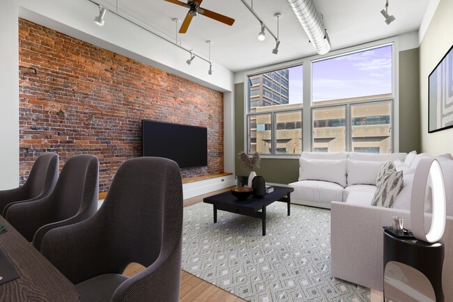 Living room with exposed brick and 12' ceilings - 15 Brown St Unit 204