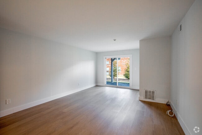 Renovated One Bedroom Living Room - Woodhull Gardens Apartments
