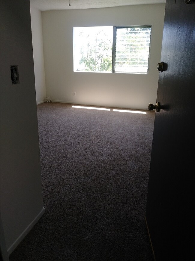 Living area/plank floor - 11290 Ohio Ave Apartments Unit 13