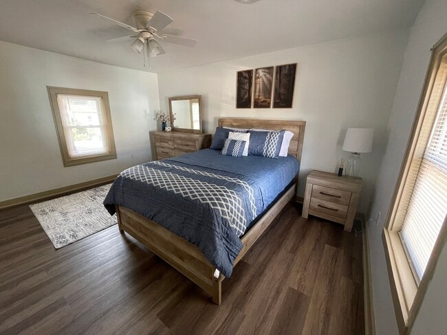 Bedroom with queen bed, dresser, nightstand, and 50" TV - 2312 Old Berwick Rd Unit Upstairs